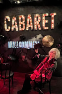 Barbara Gallay in “CABARET". Right across the floor is a video of dancing from 'West side Story'  which allows you to join in…